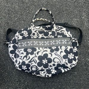 Vera Bradley travel bag with black adjustable crossbody strap